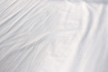 à¸ºBackground is blurred white fabric.