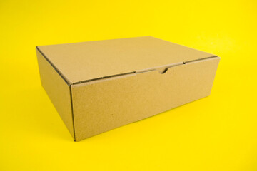 cardboard boxes of various shapes and positions isolated on a yellow background       