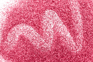glittering background of red sequins isolated on a white background closeup. Sparkle festive texture