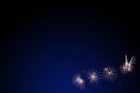colorful fireworks display on dark blue background