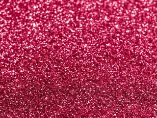 Sparkling background made of red magenta 2023 color. Color 2023 viva magenta blurred glitter backdrop for holidays and parties. Demonstrating color of 2023 year Viva Magenta