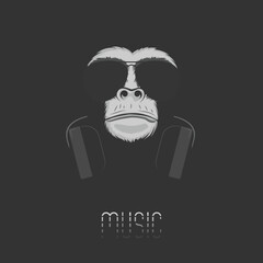 Music logo. Chimpanzee monkey in headphones and sunglasses on a black background