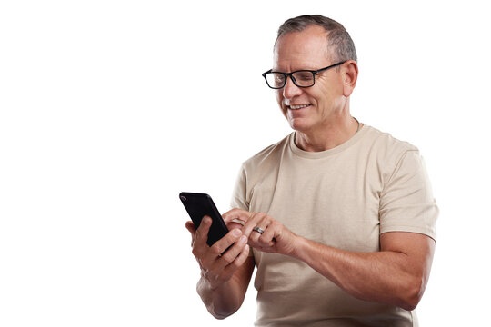 PNG Shot Of A Handsome Mature Man Standing Alone Against A Grey Background In The Studio And Using His Cellphone