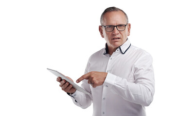 PNG shot of a handsome mature businessman standing alone against a grey background in the studio and using a digital tablet