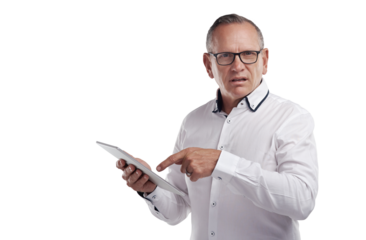 PNG shot of a handsome mature businessman standing alone against a grey background in the studio and using a digital tablet