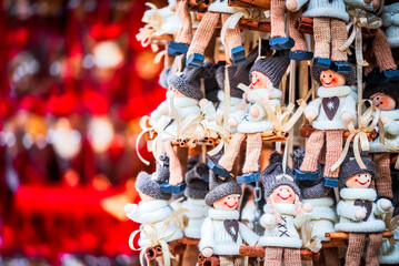 Fototapeta premium Salzburg, Austria - Winter traditional dolls ornaments for Christmas Tree, Christkindlmarkt