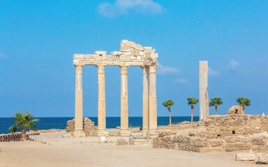 The ruined temple of Apollo, the God of sunlight. in Side (Turkey) with a stone-cut relief on the frieze. Famouse tourist destination. History, art or architecture concept