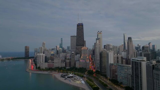 Aerial view around skyscrapers in Streeterville, cloudy Chicago, USA - orbit, drone shot