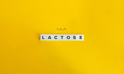 Lactose Word and Molecular Formula. Letter Tiles on Yellow Background. Minimal Aesthetics.