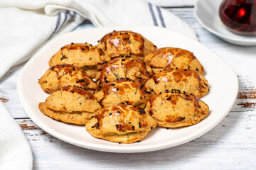 Cheese cookies. Sesame and cheese cookies on wood floor background. close up