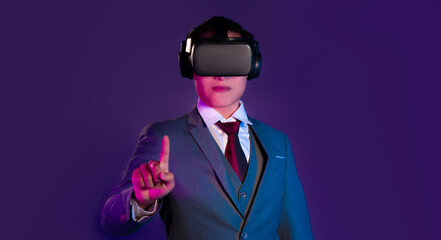 Metaverse concept. Handsome asian businessman in smart jacket suit wear black vr goggles headset...