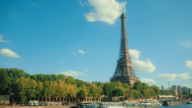 a beautiful shot of the Eiffel Tower in Paris from a bridge during summer