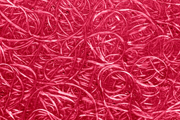 Magenta texture of compressed wood chippings board. Viva magenta color of the year 2023.