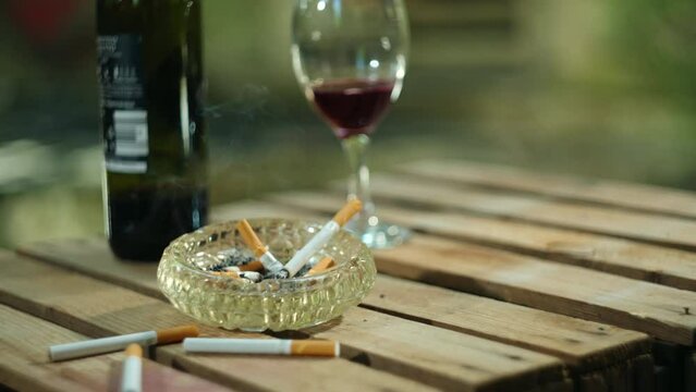 Cigarettes slowly burning in ashtray
