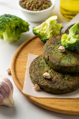 Vegan chick pea fritters on wooden plate healthy food