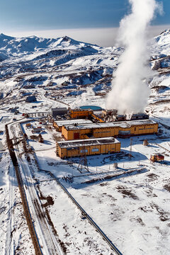 Aerial view to geothermal power plant in mountain. Clean green renewable energy in Kamchatka.