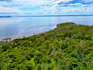 Ariel view of peninsula with clouds on the blue sky