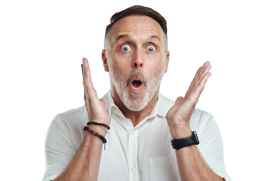 PNG studio portrait of a mature man looking surprised against a grey background