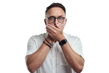 PNG studio portrait of a mature man covering his mouth and looking shocked against a grey background