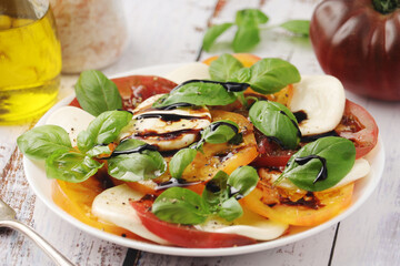 A plate with Italian salad caprese