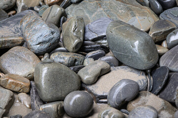 Sea pebbles close up background, copy space