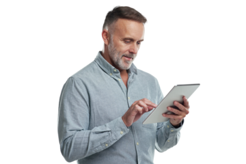 PNG studio shot of a mature man using a digital tablet against a grey background