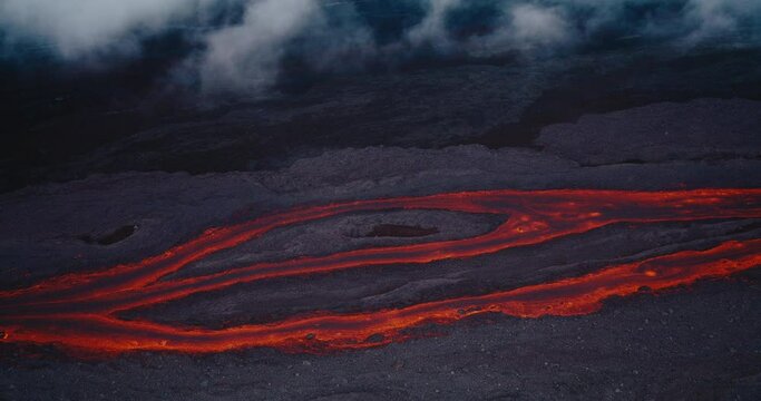 Aerial view of river of red hot molten lava flowing from the Hawaii Mauna Loa volcano eruption of 2022