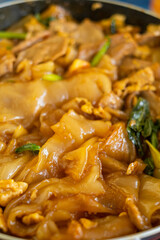 Thai food (Pad See Ew), Cooking Stir fried rice noodles with soy sauce on frying pan 