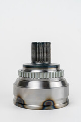 Close-up of a constant velocity joint on a white background. Universal spherical joint with constant speed new shiny. Concept of repair, car service, spare parts store