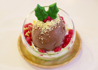 Closeup of Mouthwatering Christmas Ornament Shaped Chocolate Ice Cream in a Glass Bowl