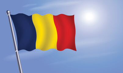 Chad flag against a blue sky
