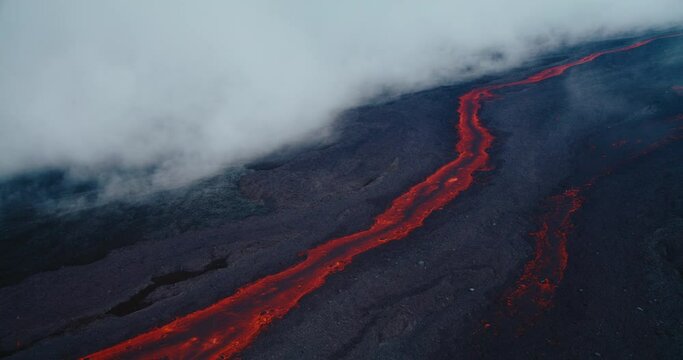 Aerial view of river of red hot molten lava flowing from the Hawaii Mauna Loa volcano eruption of 2022, Shot on RED