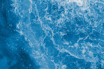 Dark blue sea surface with waves, splash - 550844923