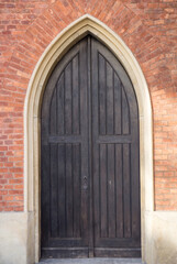 Old vintage wooden black door close-up