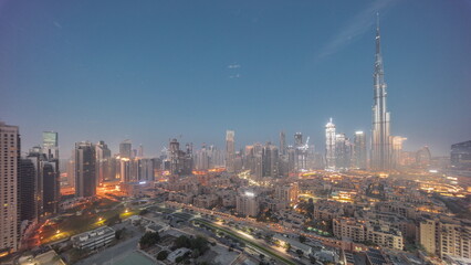 Dubai Downtown night to day timelapse with tallest skyscraper and other towers