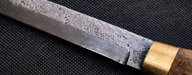 Background with a pattern of Damascus steel. Macro shot of damascus knife texture. Damascus steel with original pattern. Damascus steel pattern. © Alexander Odessa 