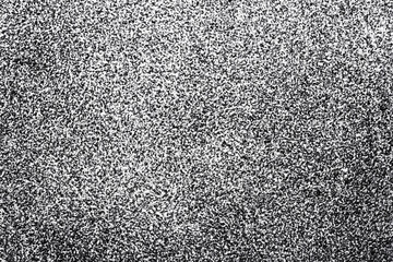 White spray paint on black paper. Noise background. Grain texture overlay. Distressed splatter background.