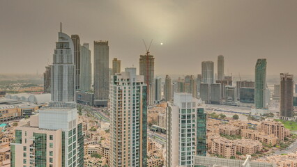 Aerial panoramic sunrise over big futuristic city timelapse. Business bay and Downtown