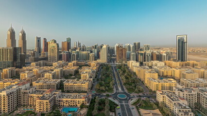 Fototapeta na wymiar Panorama showing skyscrapers in Barsha Heights district and low rise buildings in Greens district aerial timelapse. Dubai skyline