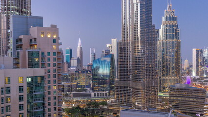 Fototapeta na wymiar Aerial view of Dubai International Financial Centre district skyscrapers day to night timelapse