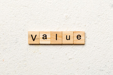 value word written on wood block. value text on table, concept