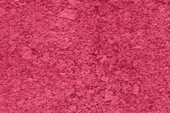 A magenta wall with texture and free space.