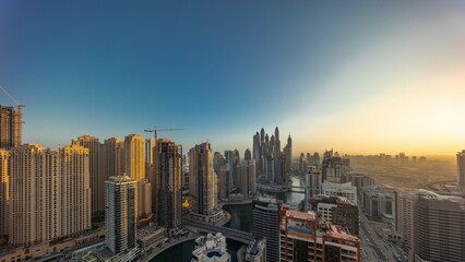 Obraz premium View of various skyscrapers in tallest recidential block in Dubai Marina aerial all day timelapse