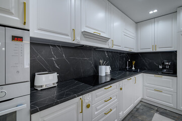 Obraz premium White luxury large modern domestic kitchen furniture