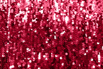 Beautiful festive background with magenta sequins.