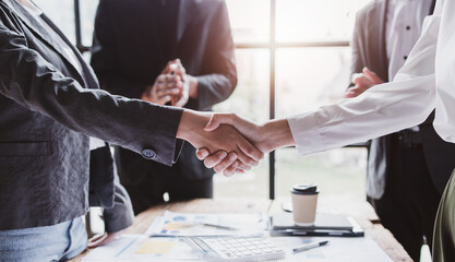 Business handshake for teamwork of business merger and acquisition,successful negotiate,hand shake,two businessman shake hand with partner to celebration partnership and business deal concept
 - obrazy, fototapety, plakaty