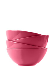 Stack of four viva magenta ceramic bowls isolated on white. Color trend year 2023.