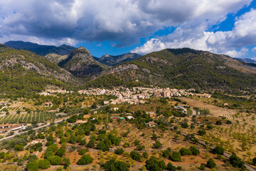 Aerial view, the village of Caimari municipality of Selva on the edge of the Tramuntana mountains with agriculture, center of the island, Mallorca, Balearic Islands, Spain