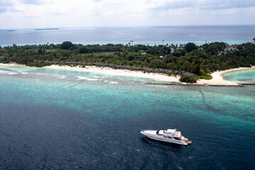Obraz na płótnie Canvas Aerial View, Asia, Indian Ocean, Maldives, Lhaviyani Atoll, Kuredu, Luxury Motor Yacht offshore