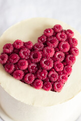 Cake with raspberry's heart decor.